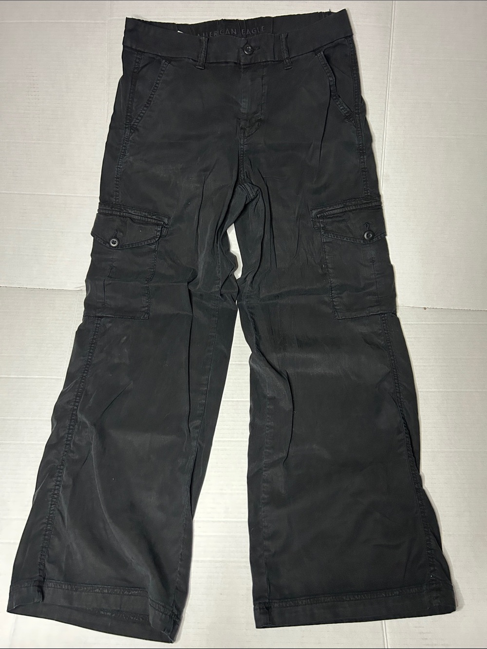 American Eagle Size 4 Black Stretch cargo wide leg jeans. Button pockets.